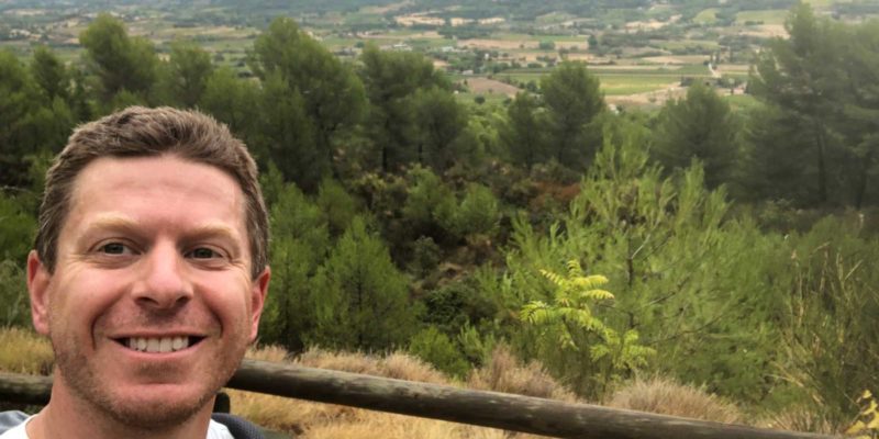 Luberon Loop author Rory Moulton poses above one of 27 perched villages through which the trail passes.
